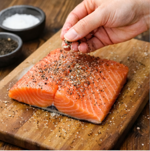 Salmon seasoned with salt and pepper