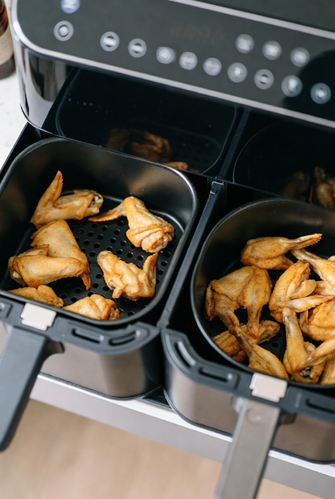 Dual basket air fryer showing two separate cooking compartments.