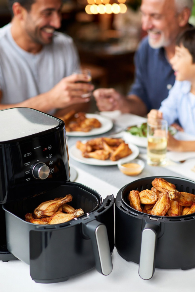 Family enjoying air fryer food together at the dining table.