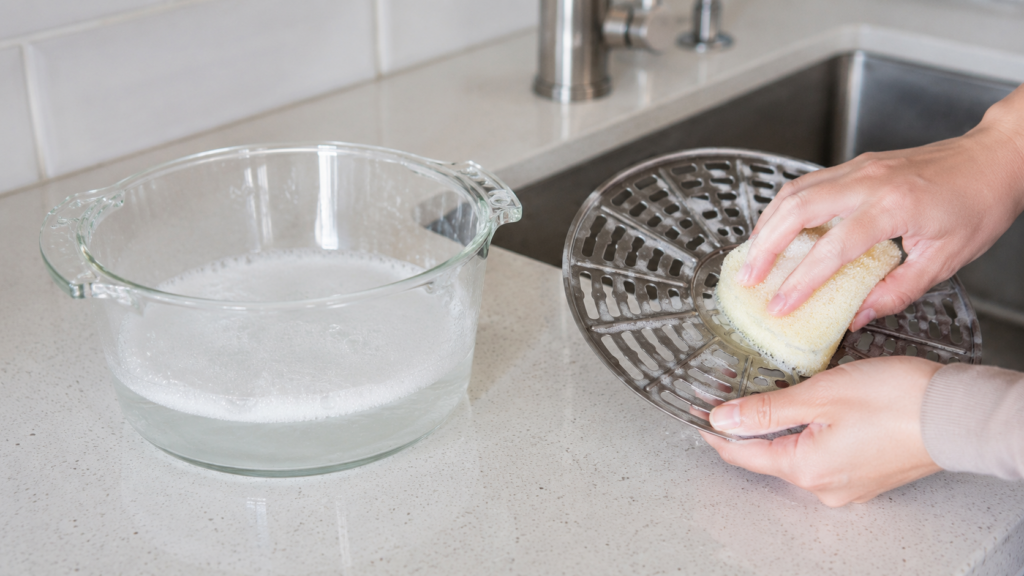 Cleaning a glass air fryer bowl and removable crisping rack